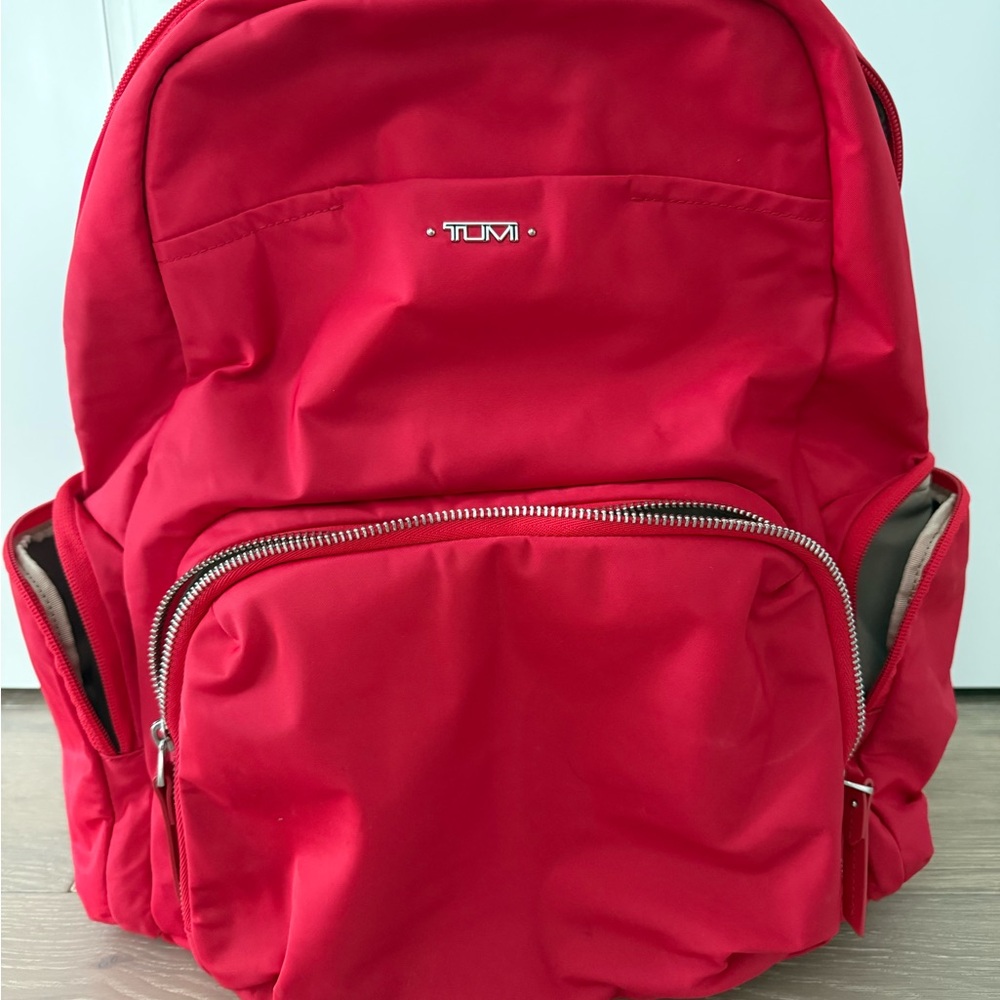 Tumi Vibrant Red Backpack
Large 
Plenty of space 
Lots of inside pockets.
